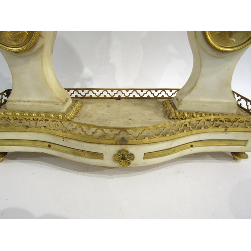 8052 - An early 19th Century French composite marble and gilt metal portico form mantel clock, the white en... 