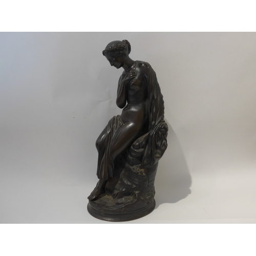 6104 - A bronze sculpture as a semi-clad female, no visible signature, 40.5cm high