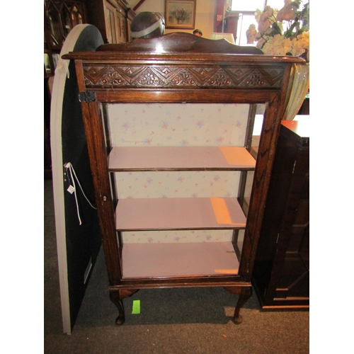 1039 - An early 20th Century oak display cabinet on cabriole legs, 126cm tall x 68cm wide x 28cm deep