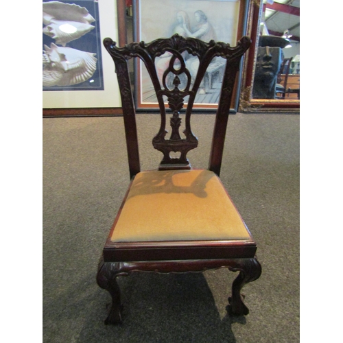 1127 - A pair of mahogany reproduction style child's chairs, drop in seats on ball and claw feet