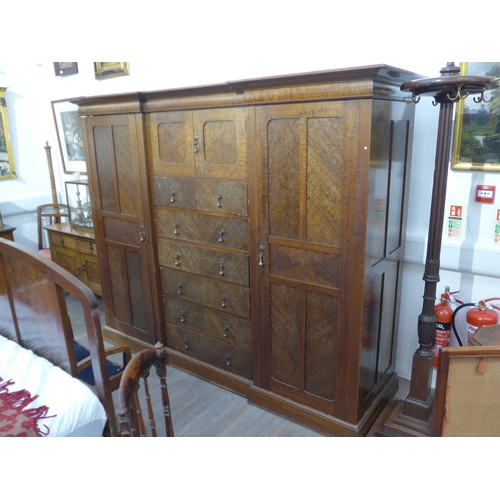 1010 - An early 20th Century nine piece bedroom suite comprising compactum wardrobe, double bed, mirrored d... 