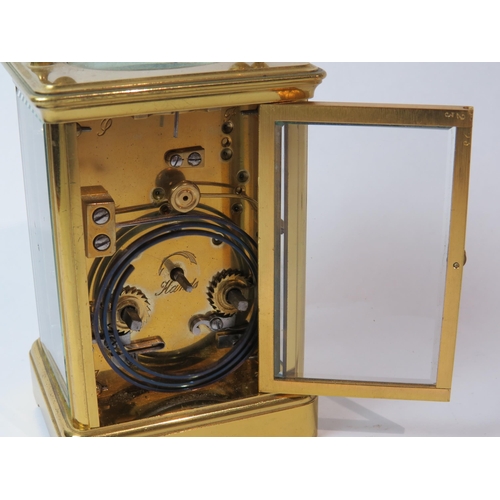 8105 - A brass cased carriage timepiece by Goldsmiths' Company, with twin barrel movement striking a gong a... 