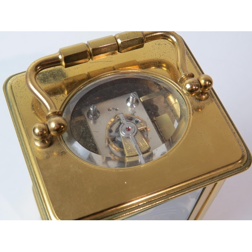 8105 - A brass cased carriage timepiece by Goldsmiths' Company, with twin barrel movement striking a gong a... 