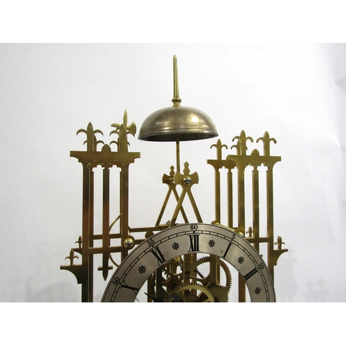 8032 - A cathedral form brass skeleton clock under large glass dome, the silvered Roman numeral chapter rin... 