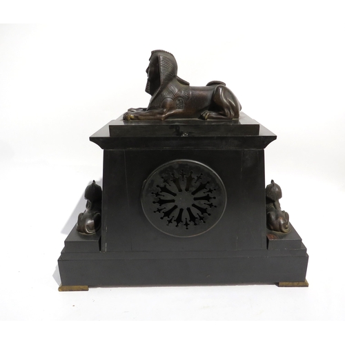 8038 - A mid-late 19th Century Egypt revival French black marble mental clock, the stepped architectural fo... 