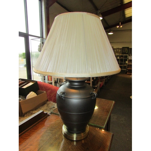 1012 - A pair of Greek urn style table lamps with cream pleated shades