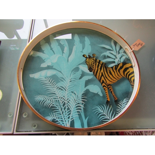 1195 - A pair of circular twin handled trays depicting foil images of Zebra, 44cm diameter