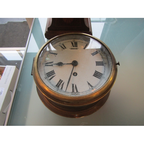 1199 - A brass cased ship's clock and an Edwardian balloon cased mantel clock