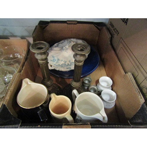 1228 - Two boxes of mixed items including brewery water jugs, column form candlesticks, plated cruets, oil ... 