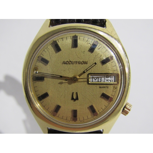 8160 - A Bulova Accutron 14k gold filled gentleman's wristwatch, champagne dial with applied baton markers,... 