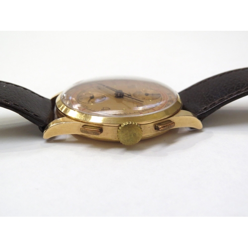 8162 - An 18ct gold cased chronograph wristwatch on leather strap, the gold coloured dial with Arabic numer... 