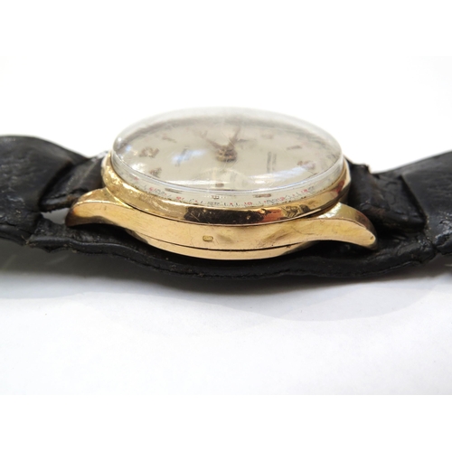 8157 - An 18ct gold cased chronograph wristwatch on a double leather strap, the silvered dial with Arabic n... 