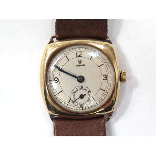 8158 - TUDOR: A 9ct gold cushion cased Tudor wristwatch on a leather strap, the silvered dial with Arabic n... 