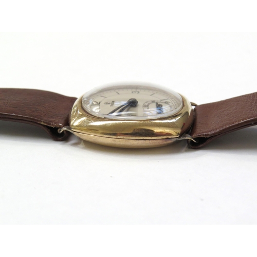 8158 - TUDOR: A 9ct gold cushion cased Tudor wristwatch on a leather strap, the silvered dial with Arabic n... 