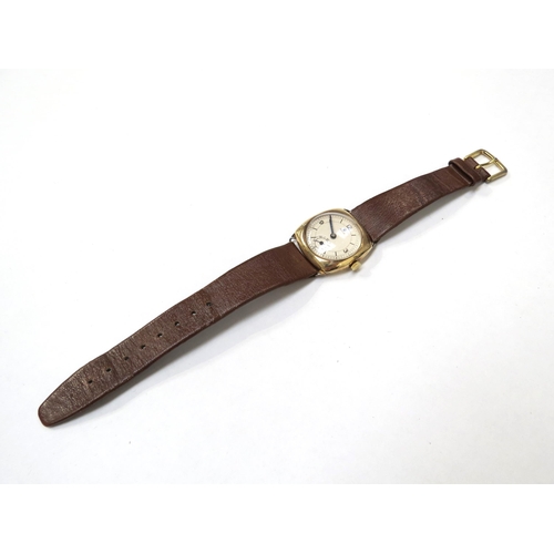 8158 - TUDOR: A 9ct gold cushion cased Tudor wristwatch on a leather strap, the silvered dial with Arabic n... 