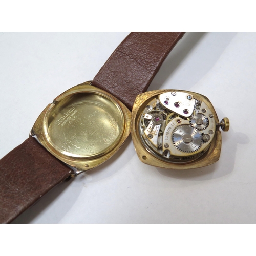 8158 - TUDOR: A 9ct gold cushion cased Tudor wristwatch on a leather strap, the silvered dial with Arabic n... 