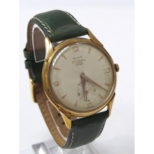 8155 - An Olma Divinal Luxe gentleman's wristwatch on a green leather strap, the textured dial with gilt Ar... 