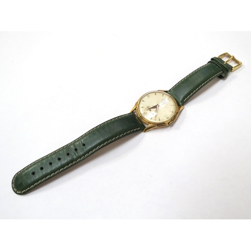 8155 - An Olma Divinal Luxe gentleman's wristwatch on a green leather strap, the textured dial with gilt Ar... 