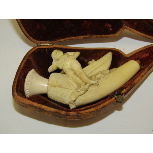 1309 - A cased Meerschaum pipe depicting a fisherman by a boat, a/f