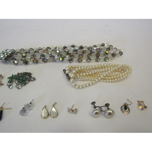 1311 - A bag of assorted necklaces including crystal, faux pearls etc.