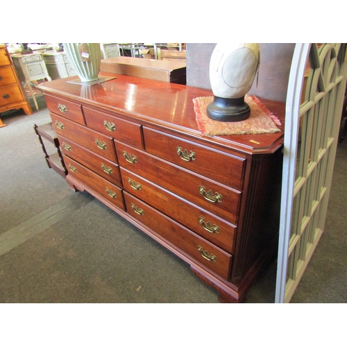 1035 - A large modern chest of nine drawers with brass handles, 87cm tall x 162cm wide x 49cm deep