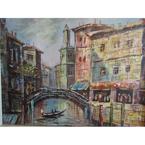 1079 - A framed oil on canvas depicting a Venetian scene with bridge, buildings and gondola, indistinctly s... 