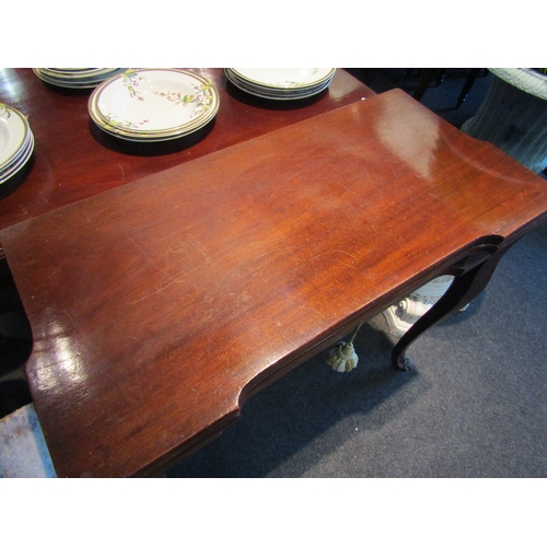 1100 - A Georgian fold-out card table with single drawer on sabre legs to paw feet