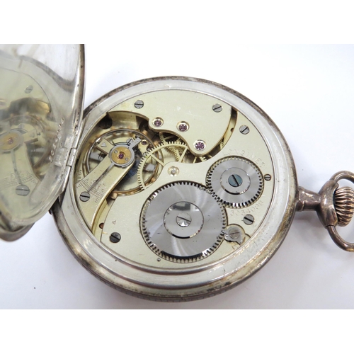 8123 - LONGINES: An early 20th Century full hunter pocket watch, case with geometric design, military prese... 