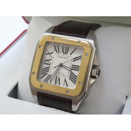 8190 - CARTIER: A gentleman's Cartier Santos 100 XL gold and stainless steel automatic wristwatch on leathe... 