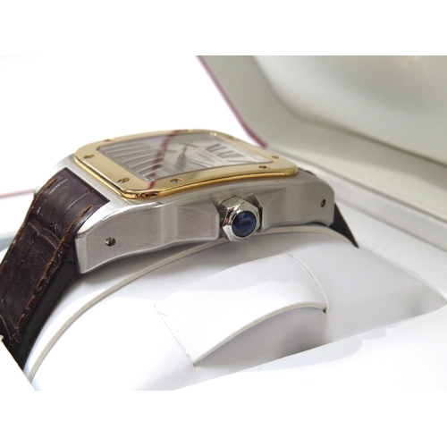 8190 - CARTIER: A gentleman's Cartier Santos 100 XL gold and stainless steel automatic wristwatch on leathe... 