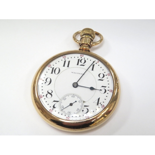 8129 - A gold plated open faced pocket watch, white Arabic dial signed 'Waltham', blued hands with subsidia... 