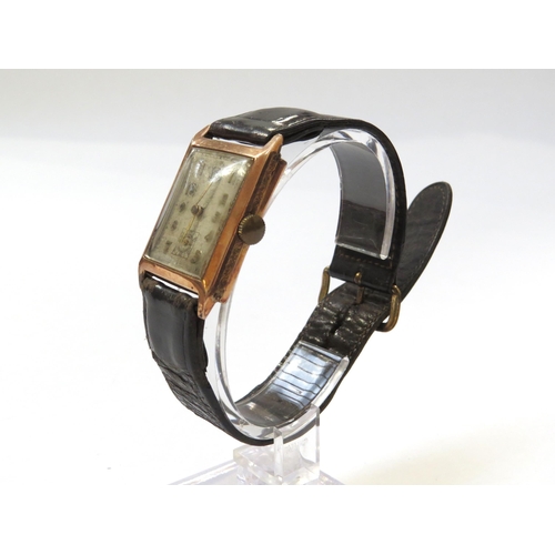 8145 - An Art Deco 9ct rose gold cased wristwatch, worn rectangular form Arabic numeral dial, with subsidia... 