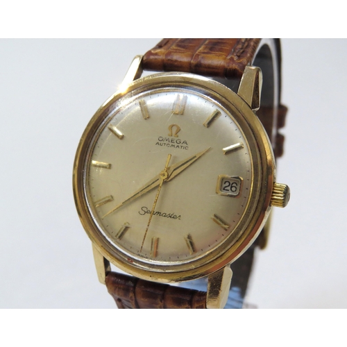 8149 - OMEGA: A 9ct gold cased Omega Seamaster Automatic wristwatch on reptile leather strap, with Omega bu... 