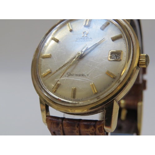 8149 - OMEGA: A 9ct gold cased Omega Seamaster Automatic wristwatch on reptile leather strap, with Omega bu... 