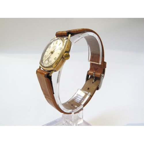 8146 - A 9ct gold cased H & G wristwatch on leather strap, Arabic numeral and baton marker dial with subsid... 