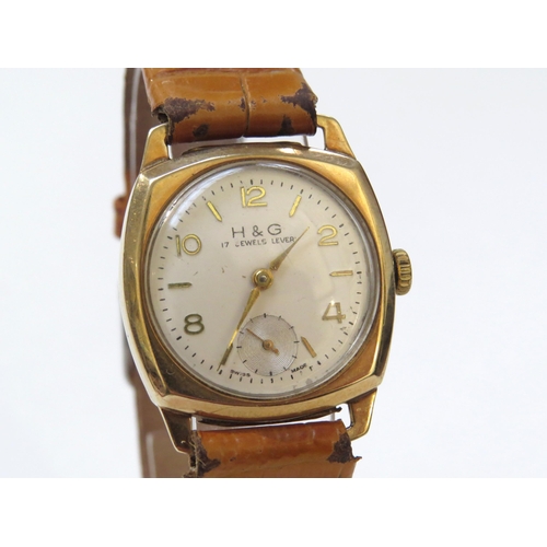 8146 - A 9ct gold cased H & G wristwatch on leather strap, Arabic numeral and baton marker dial with subsid... 