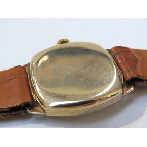 8146 - A 9ct gold cased H & G wristwatch on leather strap, Arabic numeral and baton marker dial with subsid... 