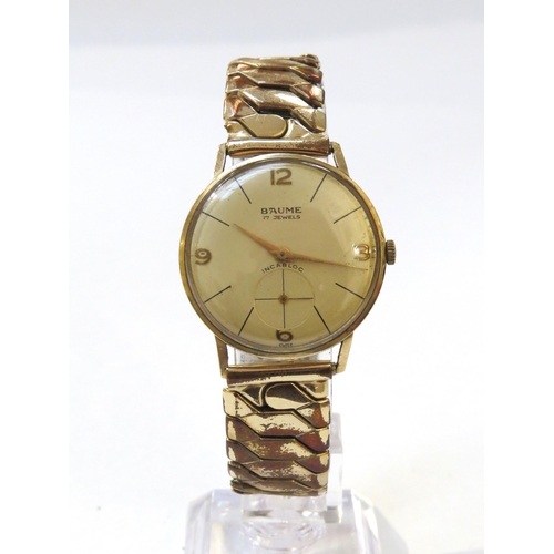 8148 - A 9ct gold cased Baume Incabloc wristwatch on expandable strap, the cream dial with Arabic numeral a... 