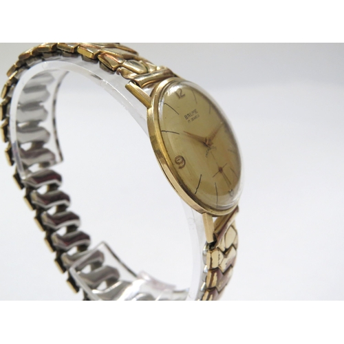 8148 - A 9ct gold cased Baume Incabloc wristwatch on expandable strap, the cream dial with Arabic numeral a... 