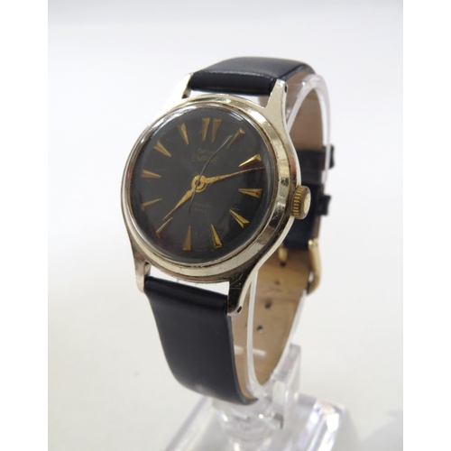 8176 - A Smiths Empire black dial gentleman's wristwatch, blue engine turned dial with gilt arrow markers i... 