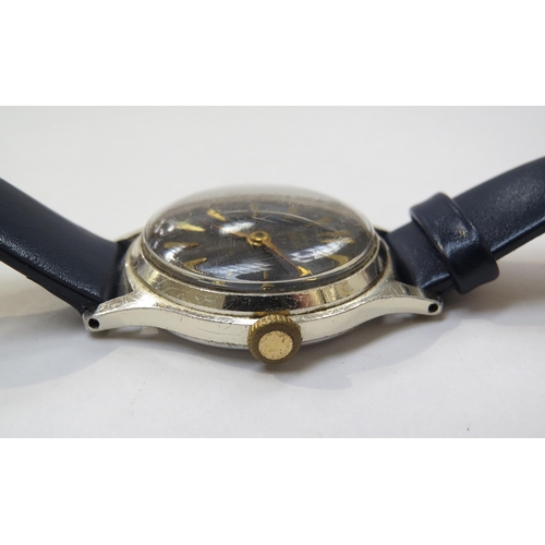 8176 - A Smiths Empire black dial gentleman's wristwatch, blue engine turned dial with gilt arrow markers i... 