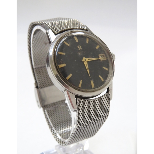 8175 - OMEGA: An Omega Seamaster automatic wristwatch circa 1961 with black dial, gold baton markers and ca... 