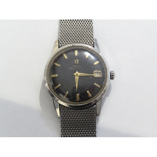 8175 - OMEGA: An Omega Seamaster automatic wristwatch circa 1961 with black dial, gold baton markers and ca... 