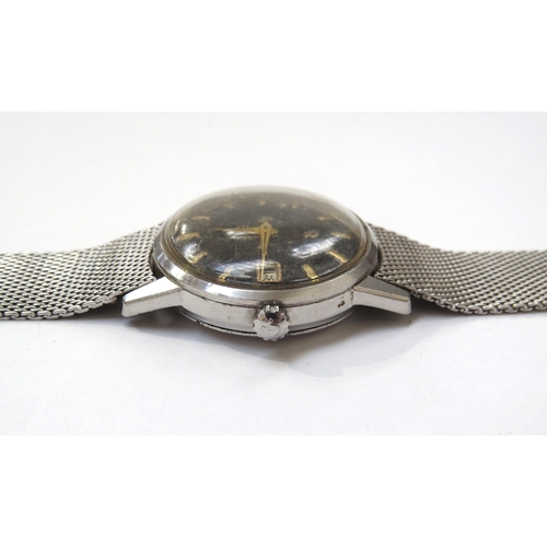 8175 - OMEGA: An Omega Seamaster automatic wristwatch circa 1961 with black dial, gold baton markers and ca... 