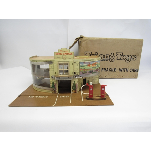 5059 - A boxed Triang Minic 'A' Garage with roof sign, forecourt, petrol pumps and functioning lift