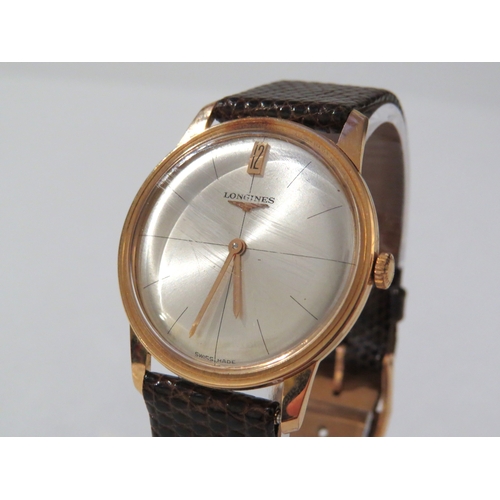 8141 - LONGINES: A Longines 18ct gold cased wristwatch on a Hirsch lizard leather strap, the thin gold case... 