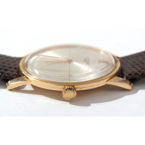 8141 - LONGINES: A Longines 18ct gold cased wristwatch on a Hirsch lizard leather strap, the thin gold case... 