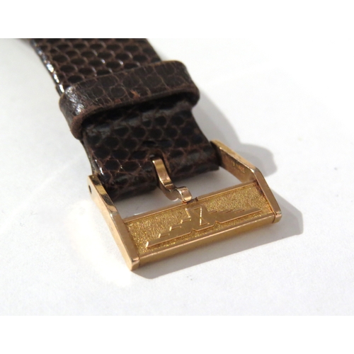 8141 - LONGINES: A Longines 18ct gold cased wristwatch on a Hirsch lizard leather strap, the thin gold case... 