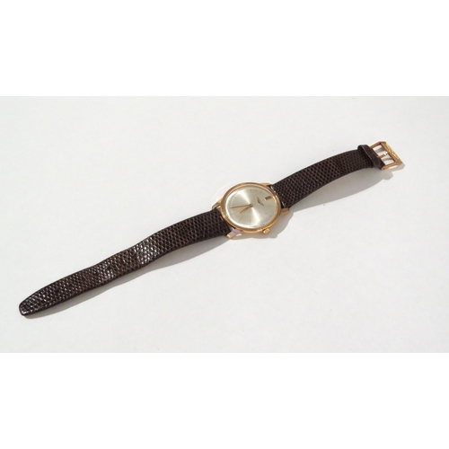 8141 - LONGINES: A Longines 18ct gold cased wristwatch on a Hirsch lizard leather strap, the thin gold case... 