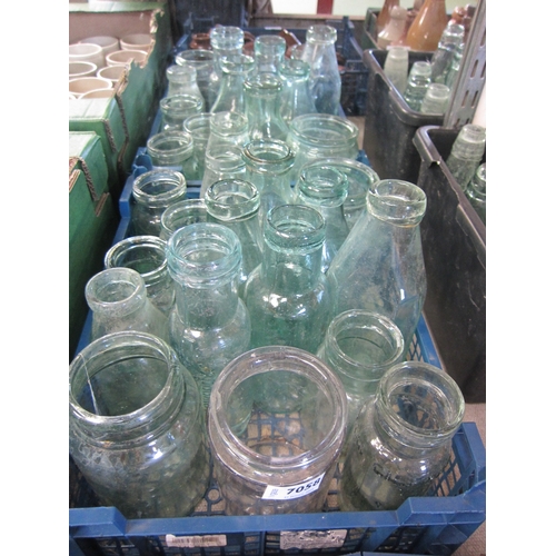 7058 - A tray of pickle glass jars